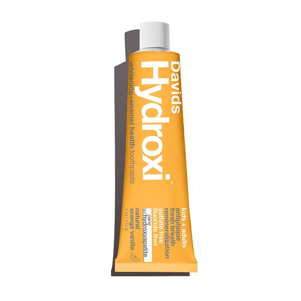 aluminum tube of Davids Hydroxi natural orange vanilla toothpaste with nano hydroxyapatite for kids and adults fluoride free 